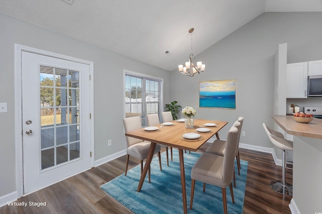 dining area with dark hardwood / wood-style flooring, a notable chandelier, and vaulted ceiling