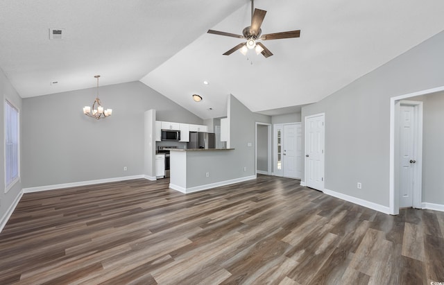 unfurnished living room featuring dark hardwood / wood-style flooring, ceiling fan with notable chandelier, and vaulted ceiling