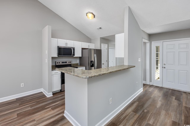 kitchen featuring appliances with stainless steel finishes, white cabinets, kitchen peninsula, light stone countertops, and dark wood-type flooring