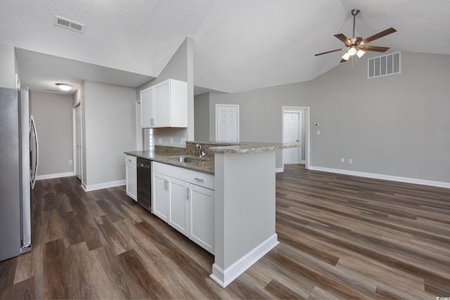 kitchen with white cabinetry, sink, light stone counters, and appliances with stainless steel finishes