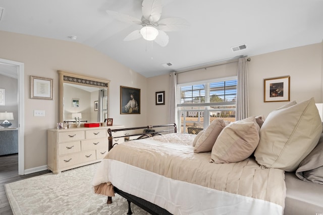 bedroom featuring vaulted ceiling, wood-type flooring, and ceiling fan