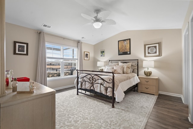 bedroom featuring vaulted ceiling, ceiling fan, and dark hardwood / wood-style flooring