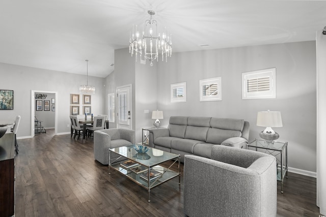 living room with lofted ceiling, dark hardwood / wood-style floors, and a chandelier