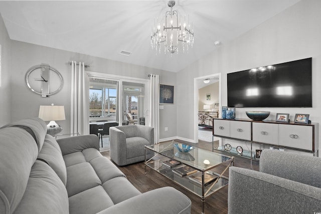 living room featuring vaulted ceiling and dark hardwood / wood-style floors