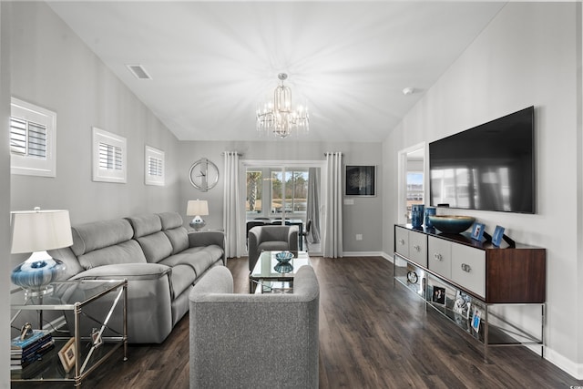 living room featuring an inviting chandelier, dark wood-type flooring, and vaulted ceiling