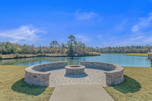 view of patio with a water view and an outdoor fire pit