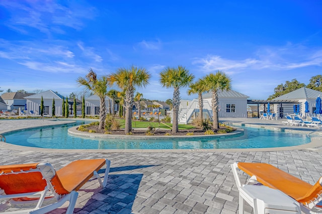 view of swimming pool with a patio