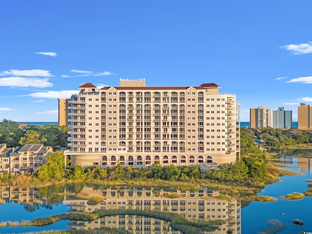 view of building exterior with a water view