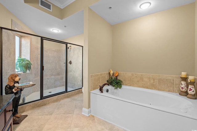 bathroom featuring tile patterned floors, separate shower and tub, and vanity