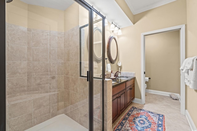 bathroom featuring vanity, crown molding, toilet, tile patterned floors, and a shower with door