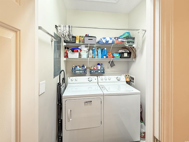 washroom with washing machine and clothes dryer