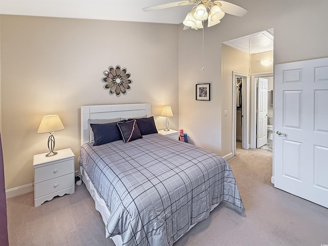 carpeted bedroom with a closet, baseboards, and ceiling fan