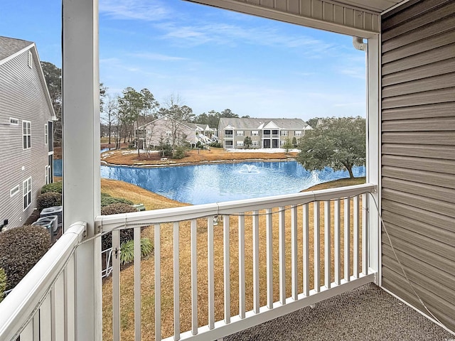 balcony featuring a water view