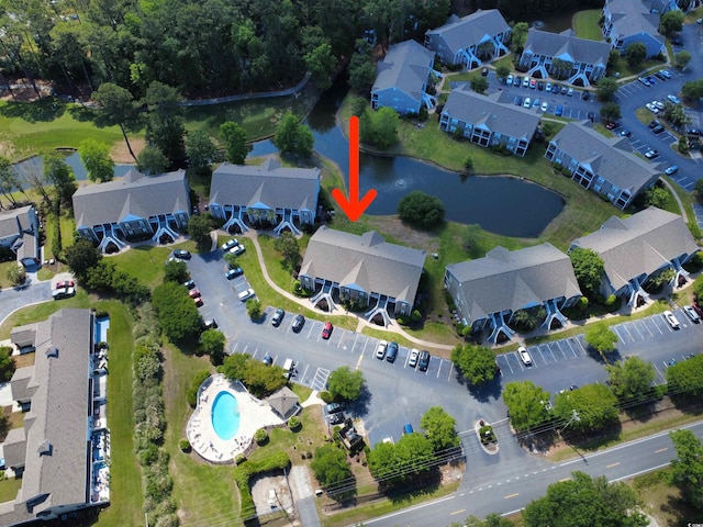 bird's eye view featuring a water view and a residential view