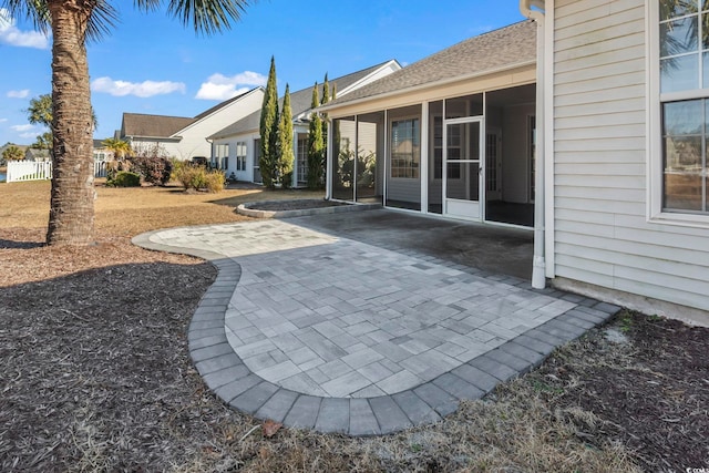 view of patio with a sunroom