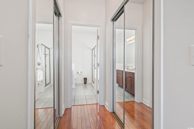 hallway featuring light wood-type flooring