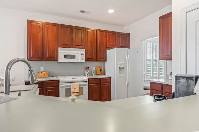 kitchen featuring sink and white appliances