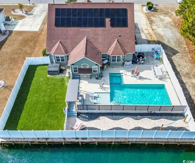 birds eye view of property with a water view