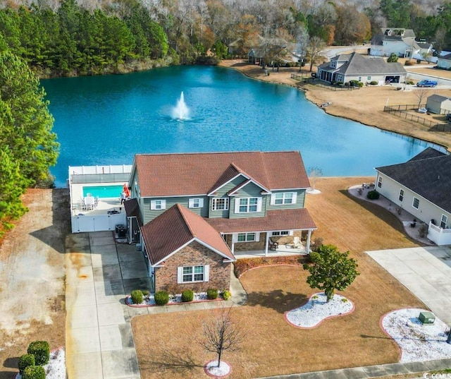 birds eye view of property featuring a water view