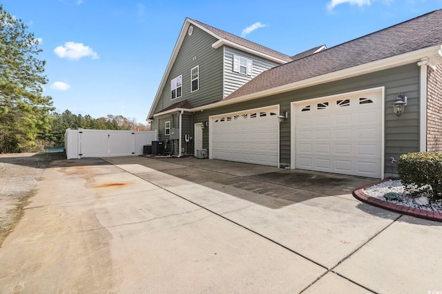 view of side of home featuring a garage