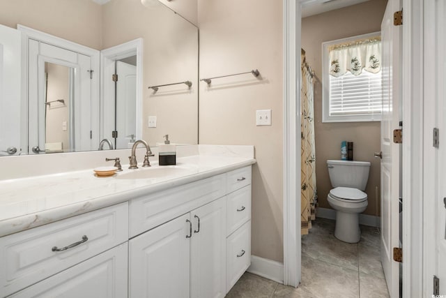 bathroom with vanity, tile patterned floors, toilet, and walk in shower