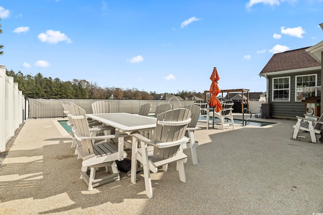 view of patio / terrace with a fenced in pool