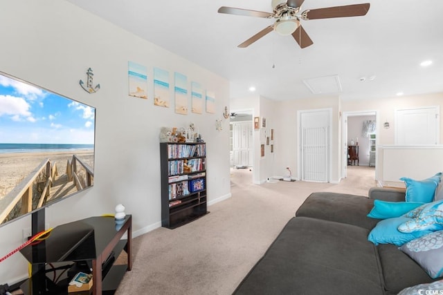 living room featuring light colored carpet and ceiling fan