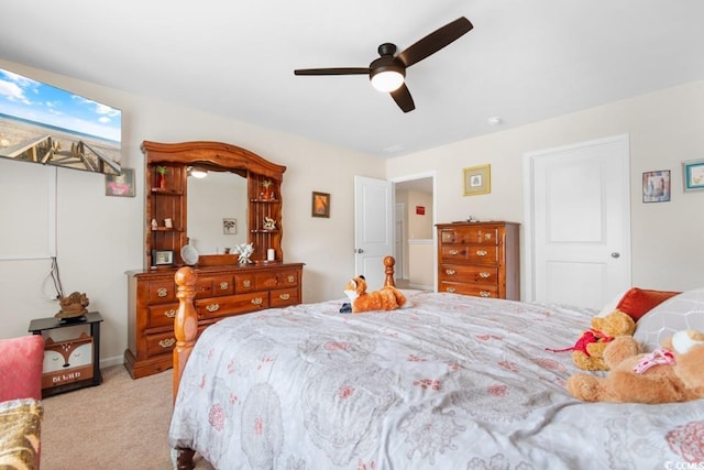 bedroom with light colored carpet and ceiling fan