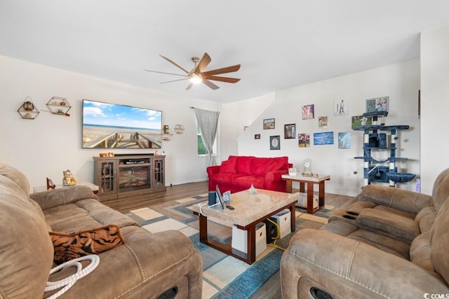 living room with ceiling fan and light hardwood / wood-style floors