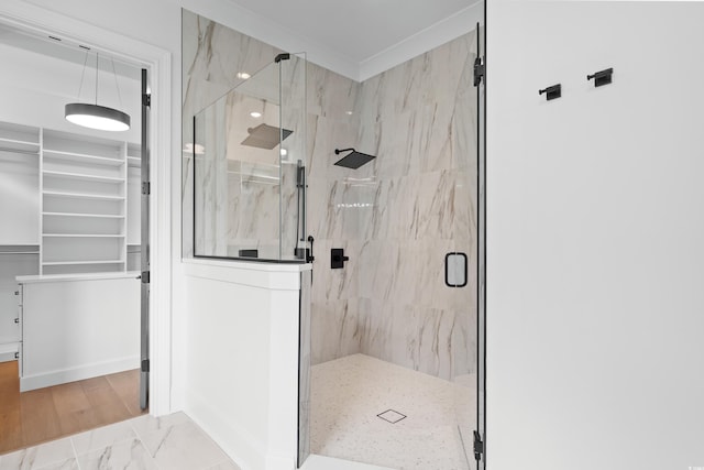 bathroom featuring a shower with shower door