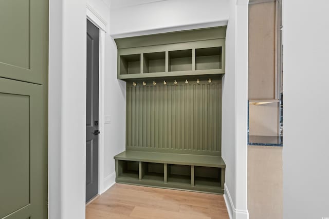 mudroom with light hardwood / wood-style floors