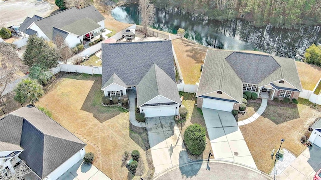 birds eye view of property with a water view