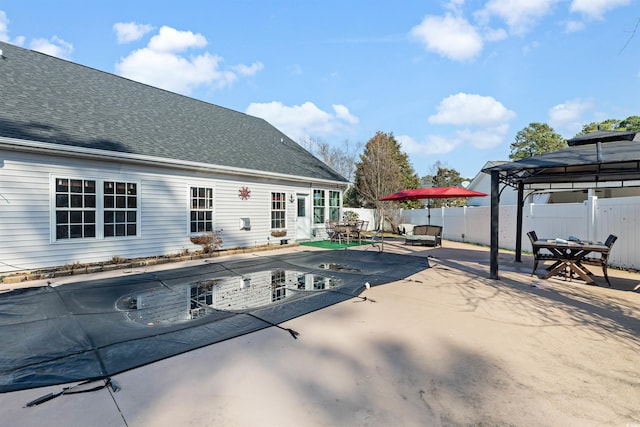 view of pool featuring a gazebo and a patio area