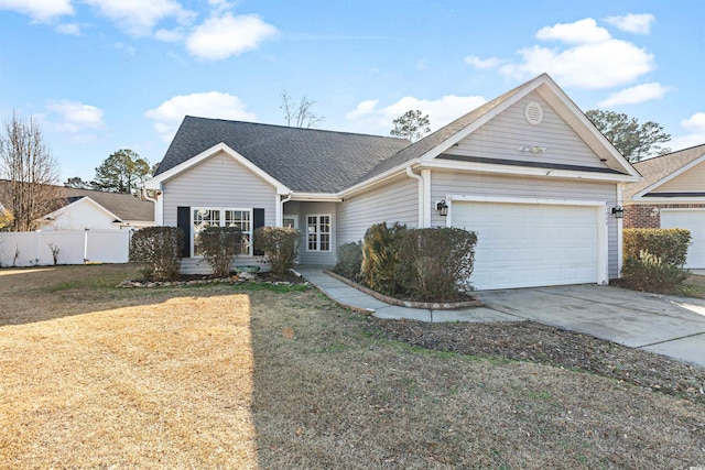 view of front facade with a garage and a front yard