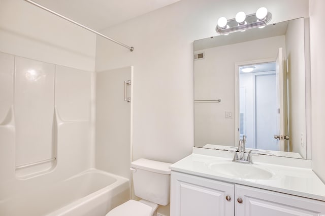 full bathroom with shower / tub combination, vanity, and toilet