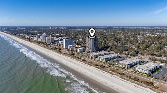 bird's eye view featuring a water view and a beach view