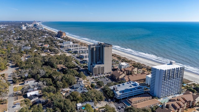 drone / aerial view featuring a view of the beach and a water view