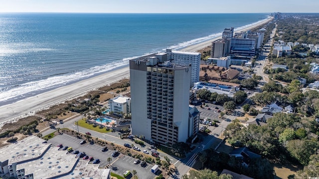 drone / aerial view with a water view and a view of the beach