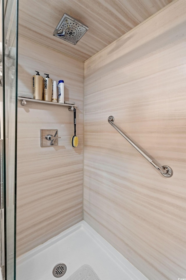 bathroom with tiled shower