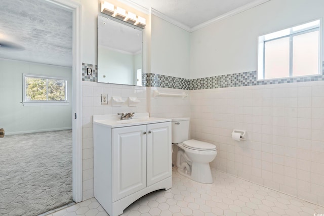 3545 Marion Ln, Murrells Inlet, SC 29576 - bathroom featuring tile walls, toilet, tile patterned flooring, ornamental molding, and vanity