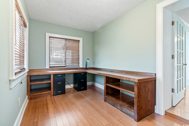 3545 Marion Ln, Murrells Inlet, SC 29576 - unfurnished office featuring baseboards, light wood-style flooring, and a textured ceiling
