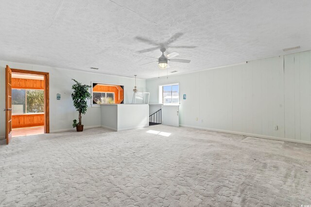 3545 Marion Ln, Murrells Inlet, SC 29576 - carpeted empty room with ceiling fan, a textured ceiling, and baseboards
