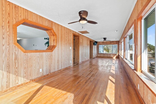 3545 Marion Ln, Murrells Inlet, SC 29576 - spare room featuring wood walls, hardwood / wood-style floors, ceiling fan, and ornamental molding