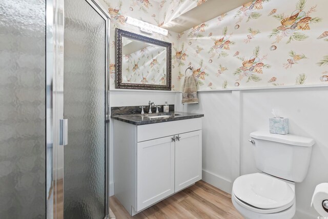 3545 Marion Ln, Murrells Inlet, SC 29576 - full bath featuring wood finished floors, a shower stall, vanity, and toilet
