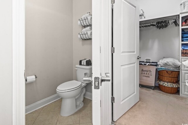 bathroom featuring tile patterned floors and toilet