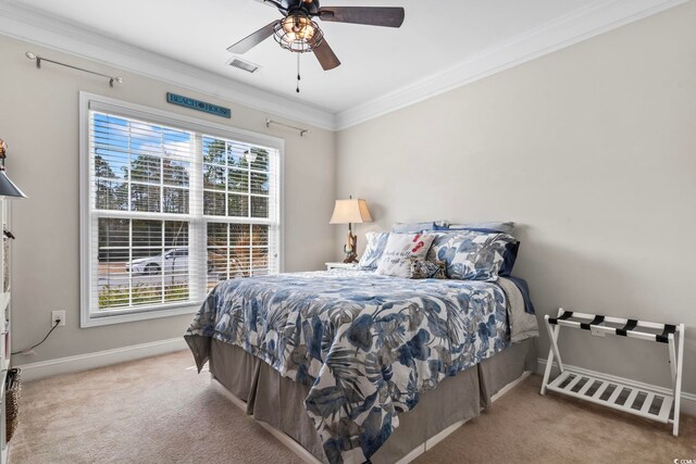 bedroom featuring crown molding, multiple windows, ceiling fan, and carpet