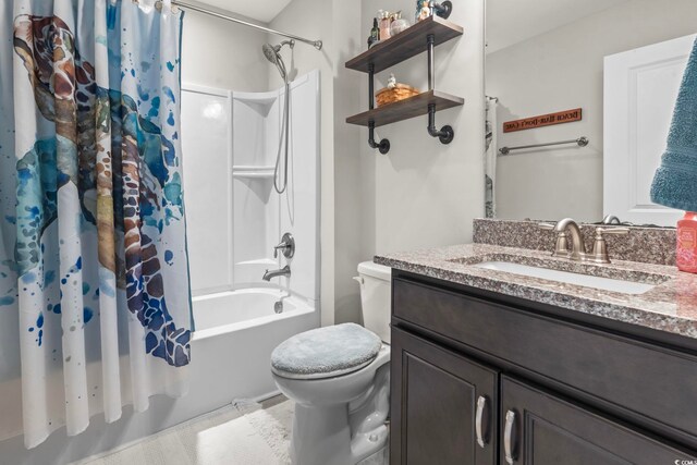 full bathroom featuring vanity, shower / bath combination with curtain, and toilet