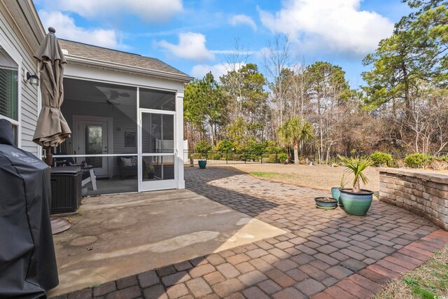 view of patio with a sunroom