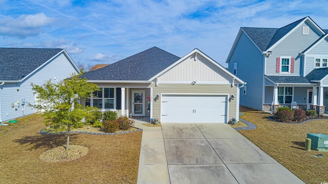 view of front of house with a garage and a front lawn