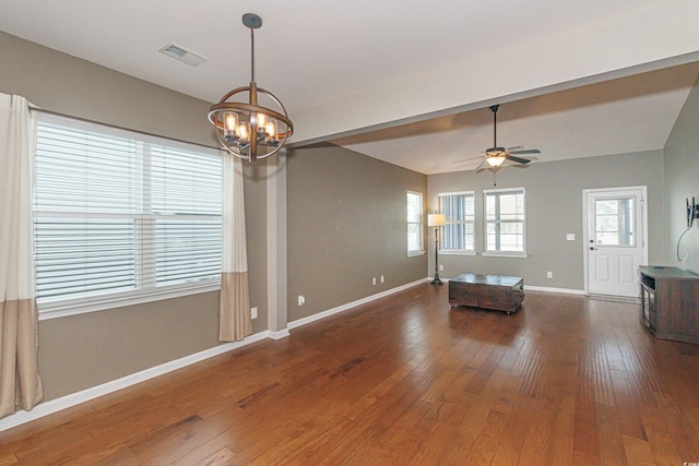 interior space featuring dark hardwood / wood-style flooring and ceiling fan with notable chandelier